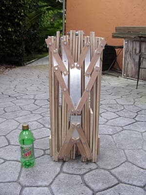 The same wooden boat, now folded flat for portability.